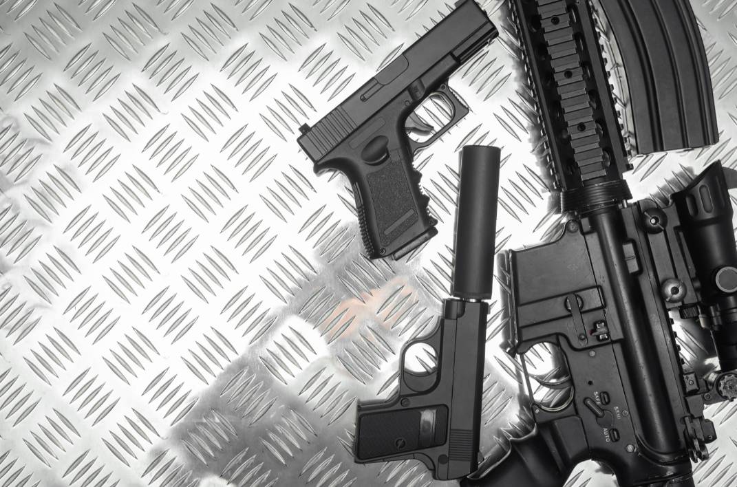 Image of airsoft guns on a metal floor